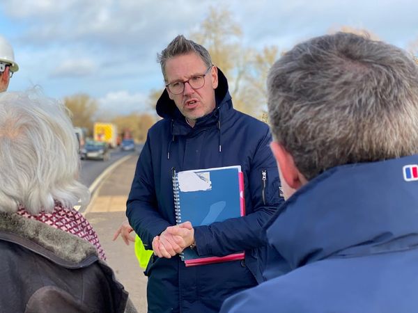 John Campion talking to two people
