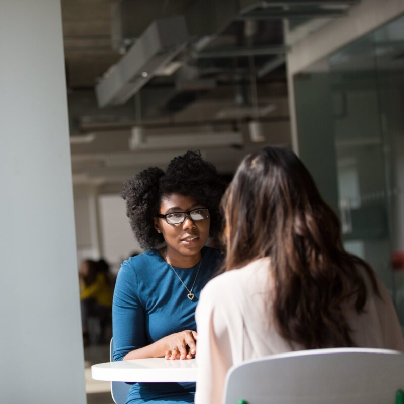 Two people talking in a 1 to 1 session